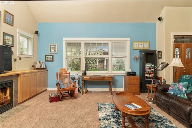 1703 Webb Lake Dr, Silverton, OR 97381 - carpeted living area with baseboards, lofted ceiling, and a tile fireplace