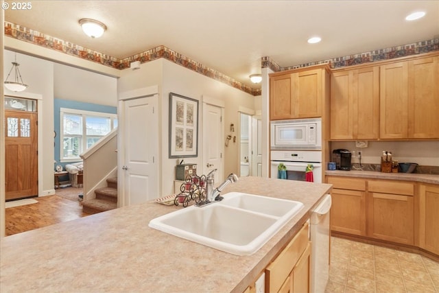 1703 Webb Lake Dr, Silverton, OR 97381 - kitchen with light countertops, recessed lighting, white appliances, light brown cabinetry, and a sink