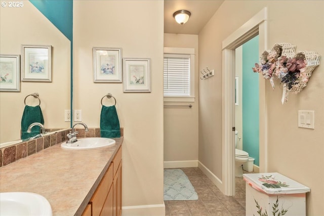 1703 Webb Lake Dr, Silverton, OR 97381 - full bath with toilet, a sink, tile patterned flooring, baseboards, and double vanity