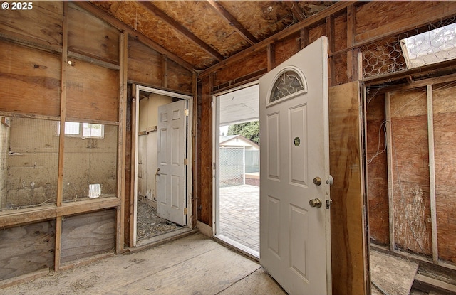 entrance foyer featuring lofted ceiling