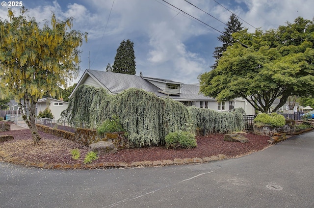 view of side of property with fence