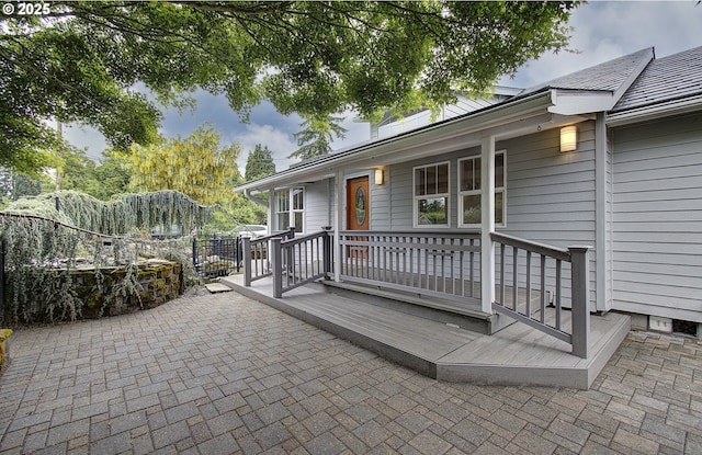 exterior space with a wooden deck and fence