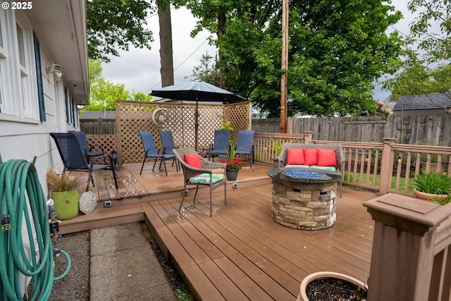 2580 Elysium Ave, Eugene, OR 97401 - wooden terrace with a fire pit and a fenced backyard