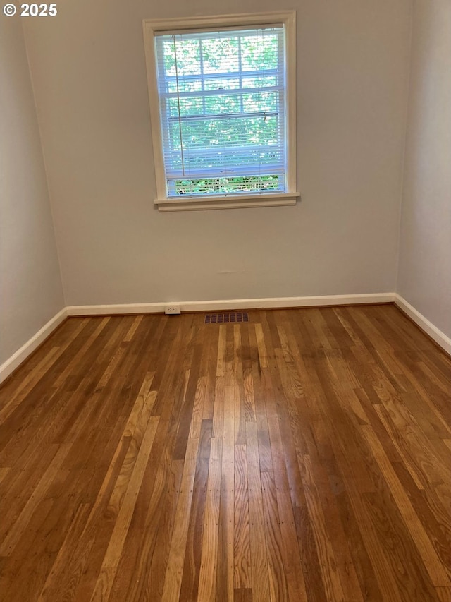 empty room featuring hardwood / wood-style floors