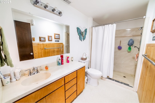 bathroom with a shower with curtain, vanity, and toilet