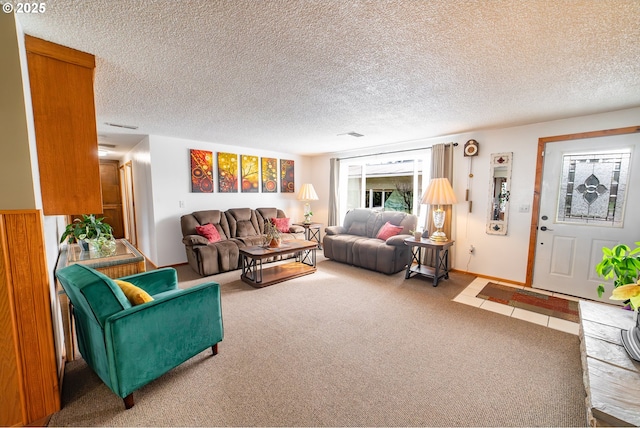 carpeted living room with a textured ceiling