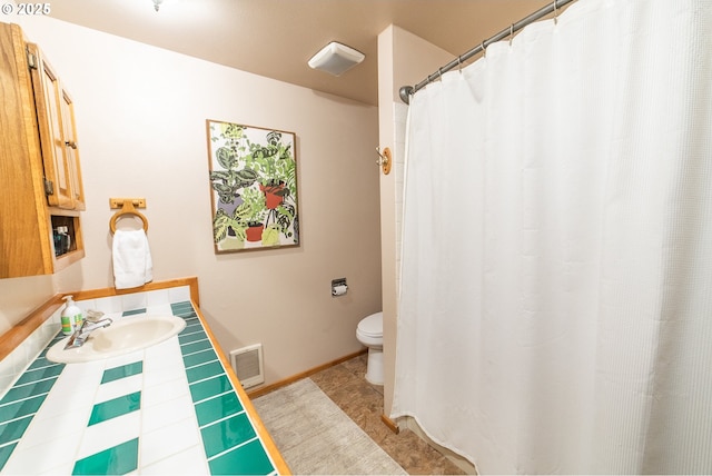 bathroom with toilet and sink