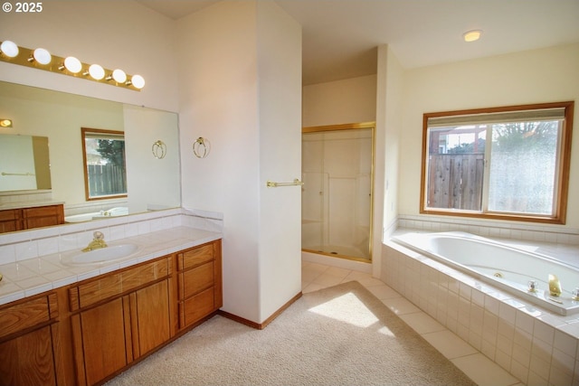 full bath featuring vanity, baseboards, tile patterned flooring, a shower stall, and a bath