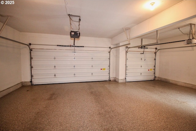 garage featuring baseboards and a garage door opener