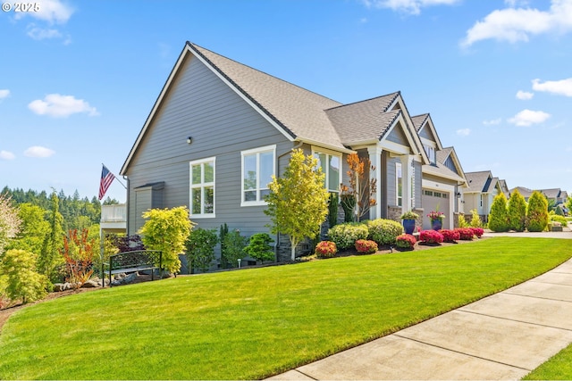 view of side of home featuring a garage, a yard, and driveway