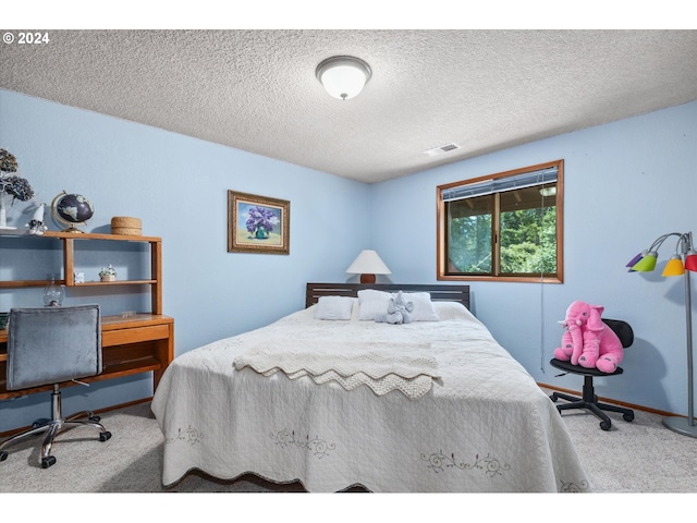 carpeted bedroom with baseboards and visible vents