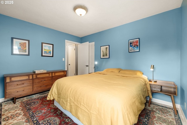 bedroom featuring baseboards