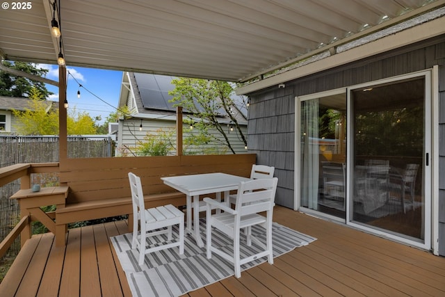 deck featuring outdoor dining area