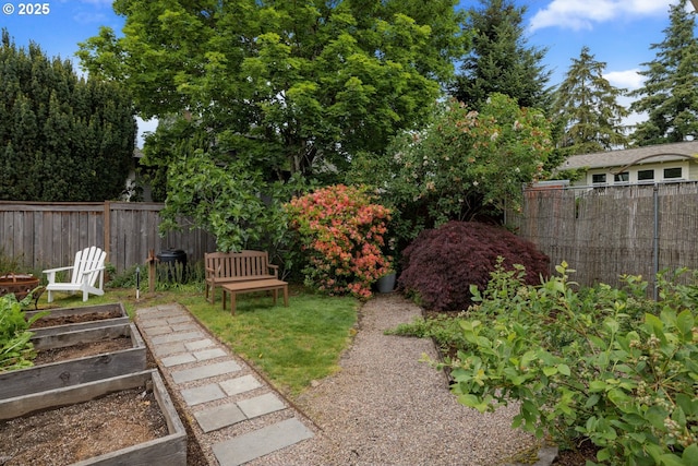 view of yard featuring a garden and fence