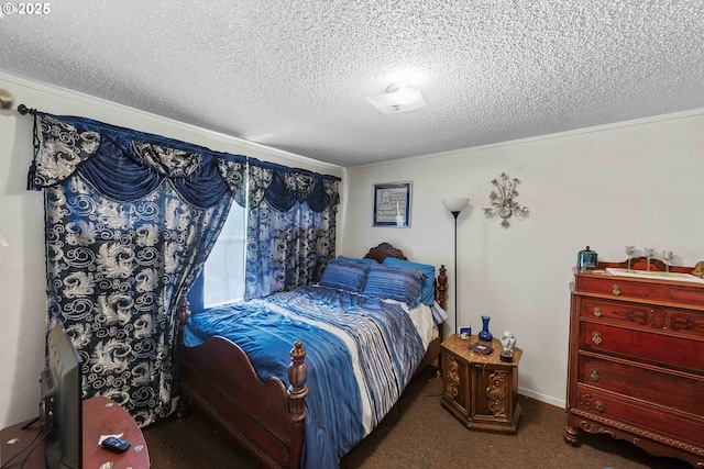 bedroom with a textured ceiling and carpet floors