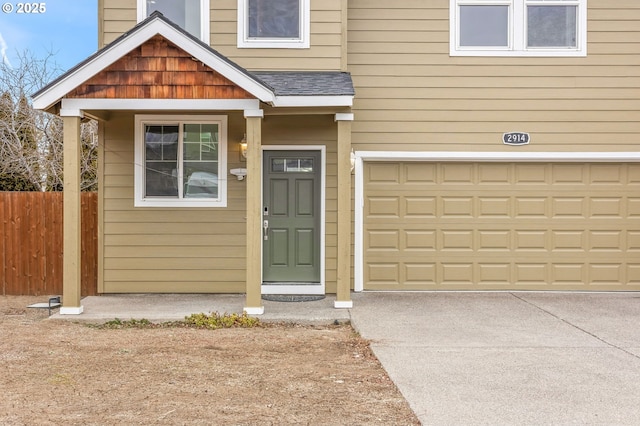 view of exterior entry featuring a garage