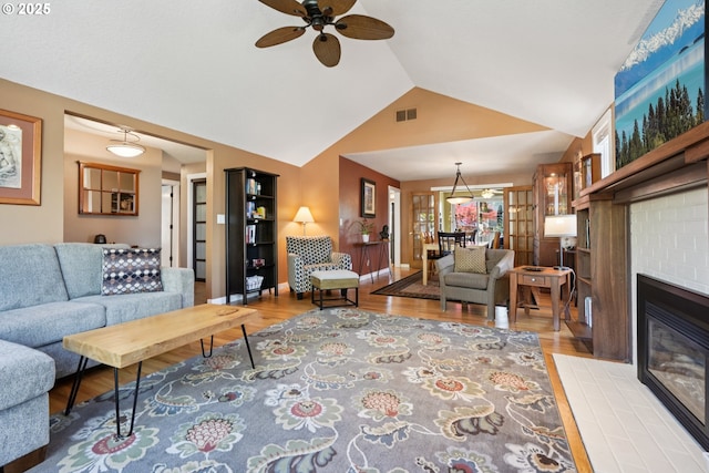 3119 SE 154th Ave, Vancouver, WA 98683 - living area with ceiling fan, wood finished floors, a brick fireplace, and high vaulted ceiling