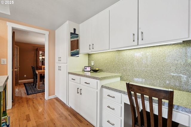 3119 SE 154th Ave, Vancouver, WA 98683 - kitchen with light countertops, light wood-type flooring, white cabinets, and tasteful backsplash