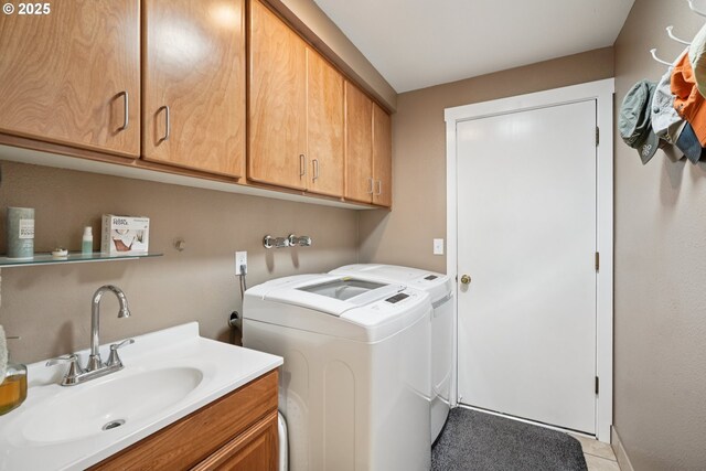 3119 SE 154th Ave, Vancouver, WA 98683 - washroom with washing machine and dryer, cabinet space, and light tile patterned flooring