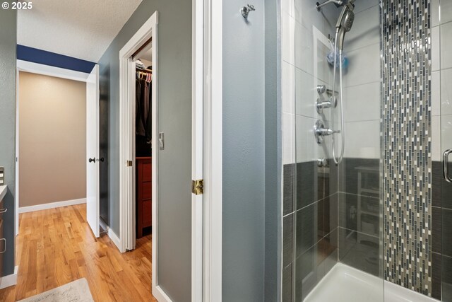 3119 SE 154th Ave, Vancouver, WA 98683 - full bath featuring a stall shower, wood finished floors, a walk in closet, and vanity