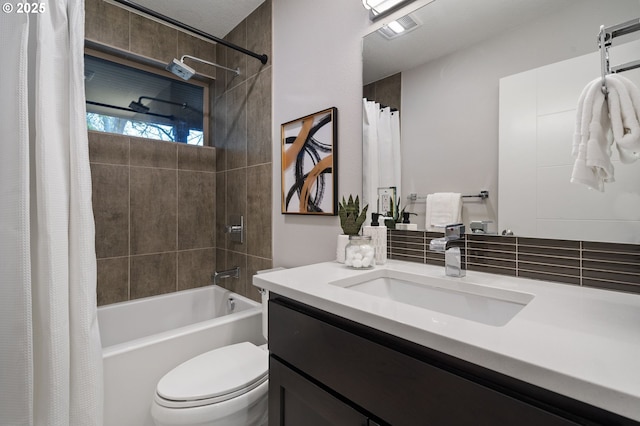 full bathroom featuring toilet, vanity, and shower / bathtub combination with curtain