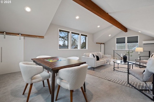 dining area with a barn door, lofted ceiling with beams, light carpet, and an AC wall unit