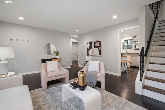 living room with dark hardwood / wood-style flooring