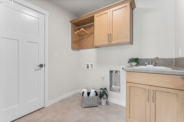 clothes washing area with gas dryer hookup, cabinets, sink, washer hookup, and hookup for an electric dryer