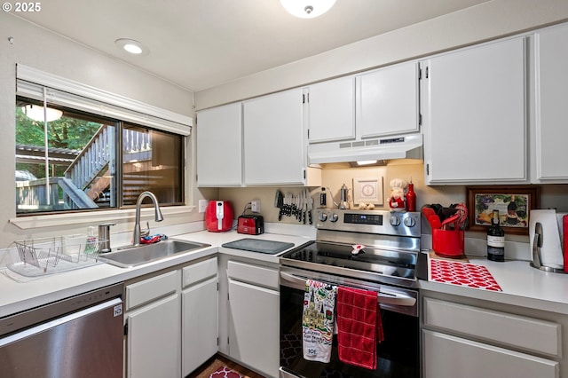 151 Treehill Loop, Eugene, OR 97405 - kitchen with appliances with stainless steel finishes, under cabinet range hood, a sink, light countertops, and recessed lighting