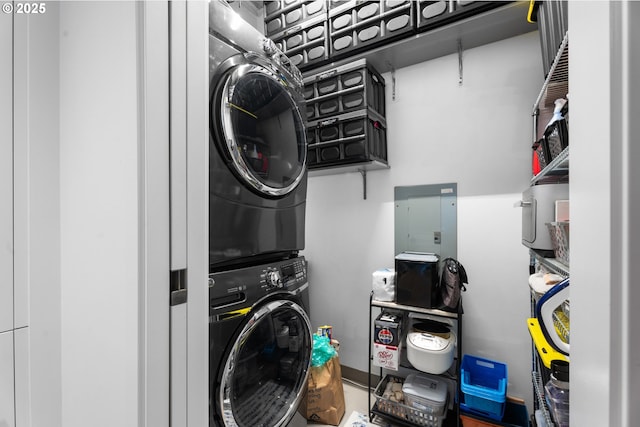 laundry area featuring stacked washing maching and dryer