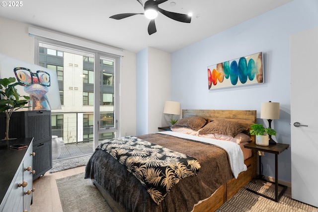 bedroom with ceiling fan and light wood-type flooring