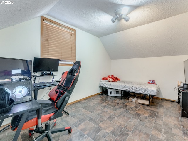 611 NW 4th Pl, Battle Ground, WA 98604 - home office featuring a textured ceiling, vaulted ceiling, and stone finish flooring
