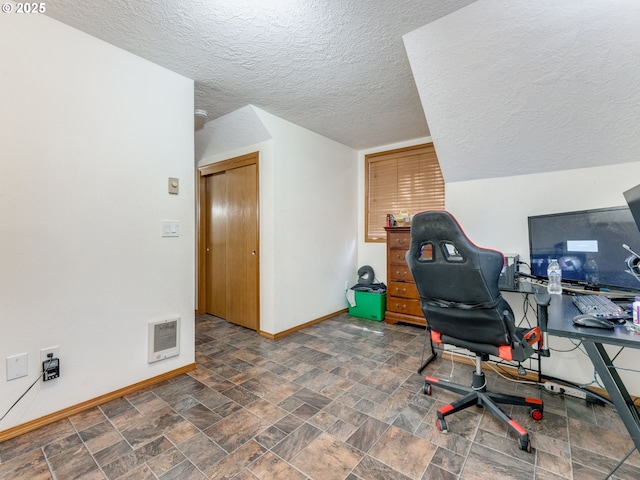 611 NW 4th Pl, Battle Ground, WA 98604 - office space with a textured ceiling and stone finish floors