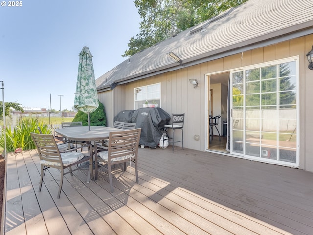 611 NW 4th Pl, Battle Ground, WA 98604 - wooden deck featuring outdoor dining area and a grill