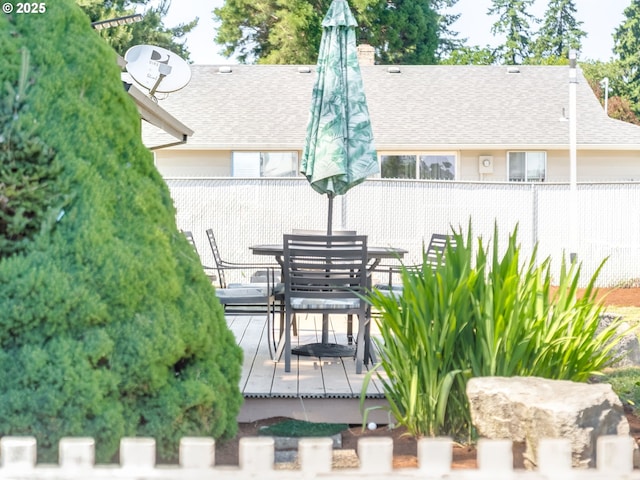 611 NW 4th Pl, Battle Ground, WA 98604 - rear view of property with a shingled roof, a deck, outdoor dining area, and a chimney