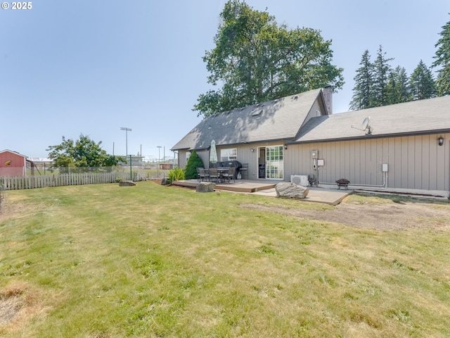 611 NW 4th Pl, Battle Ground, WA 98604 - back of house with a chimney and a patio