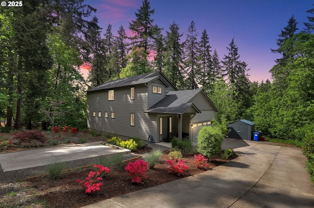 1345 Skyline Park Loop, Eugene, OR 97405 - view of front of home featuring a garage, a shed, and concrete driveway