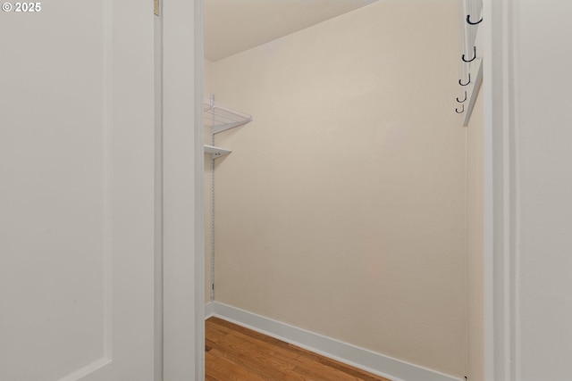 spacious closet featuring light wood-style flooring
