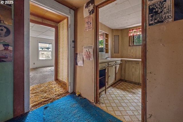 hallway featuring light floors