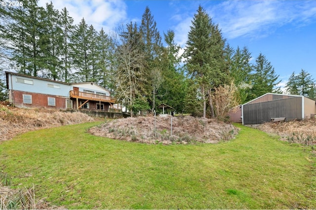 view of yard featuring a wooden deck