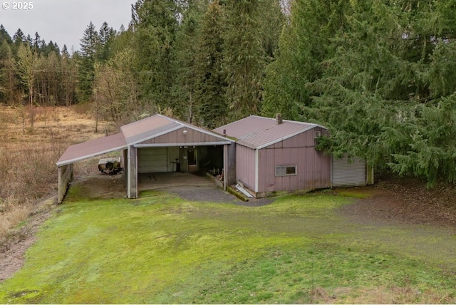 birds eye view of property featuring a view of trees