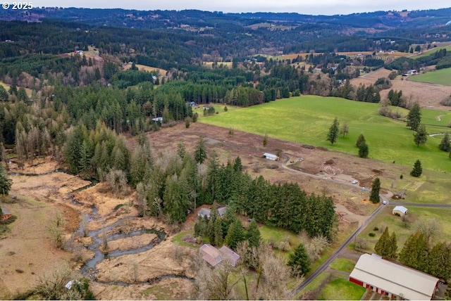 aerial view with a forest view and a rural view