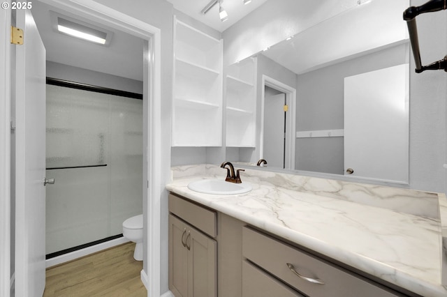 1500 Norkenzie Rd, Eugene, OR 97401 - bathroom featuring a shower stall, wood finished floors, and vanity