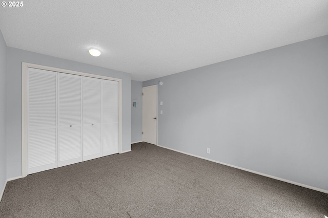 1500 Norkenzie Rd, Eugene, OR 97401 - unfurnished bedroom featuring carpet floors, a textured ceiling, and a closet