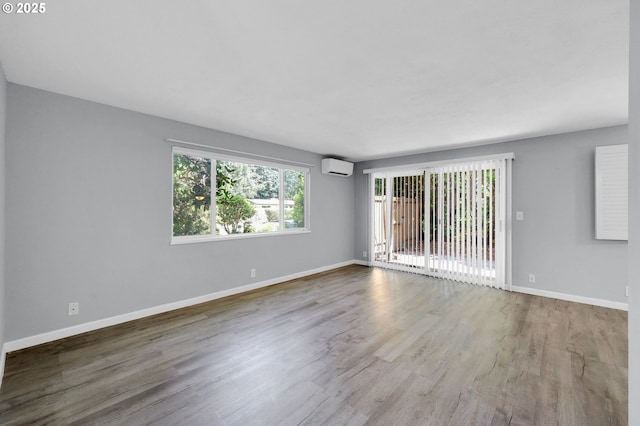1500 Norkenzie Rd, Eugene, OR 97401 - empty room with wood finished floors and a wall mounted AC