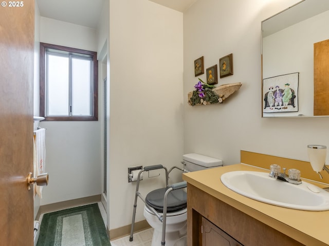 full bath featuring toilet, vanity, and a shower