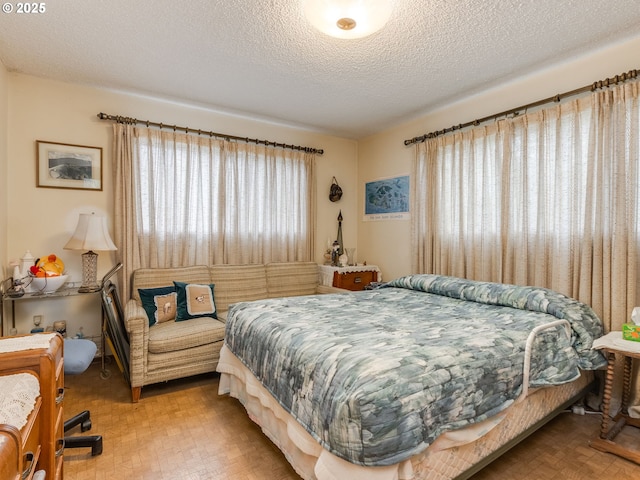 bedroom featuring a textured ceiling