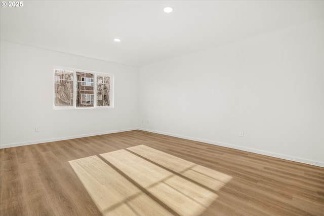 unfurnished room featuring hardwood / wood-style floors