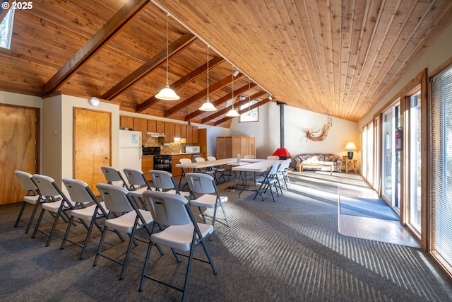 carpeted dining room featuring high vaulted ceiling, beam ceiling, and wooden ceiling