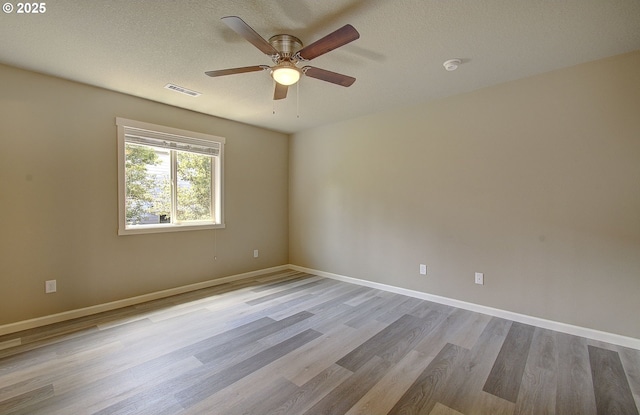 9513 NE 73rd St, Vancouver, WA 98662 - empty room featuring wood finished floors, ceiling fan, baseboards, and a textured ceiling